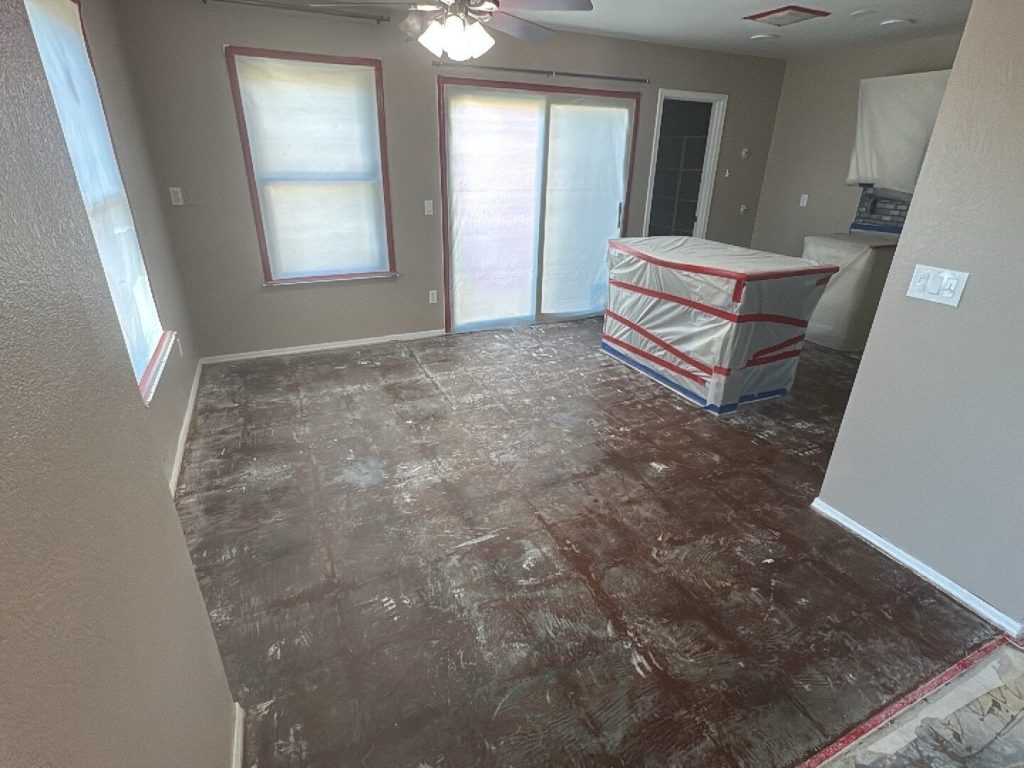 Room prepped for Water Damage Restoration in Cave Creek, AZ; windows and doors taped off.